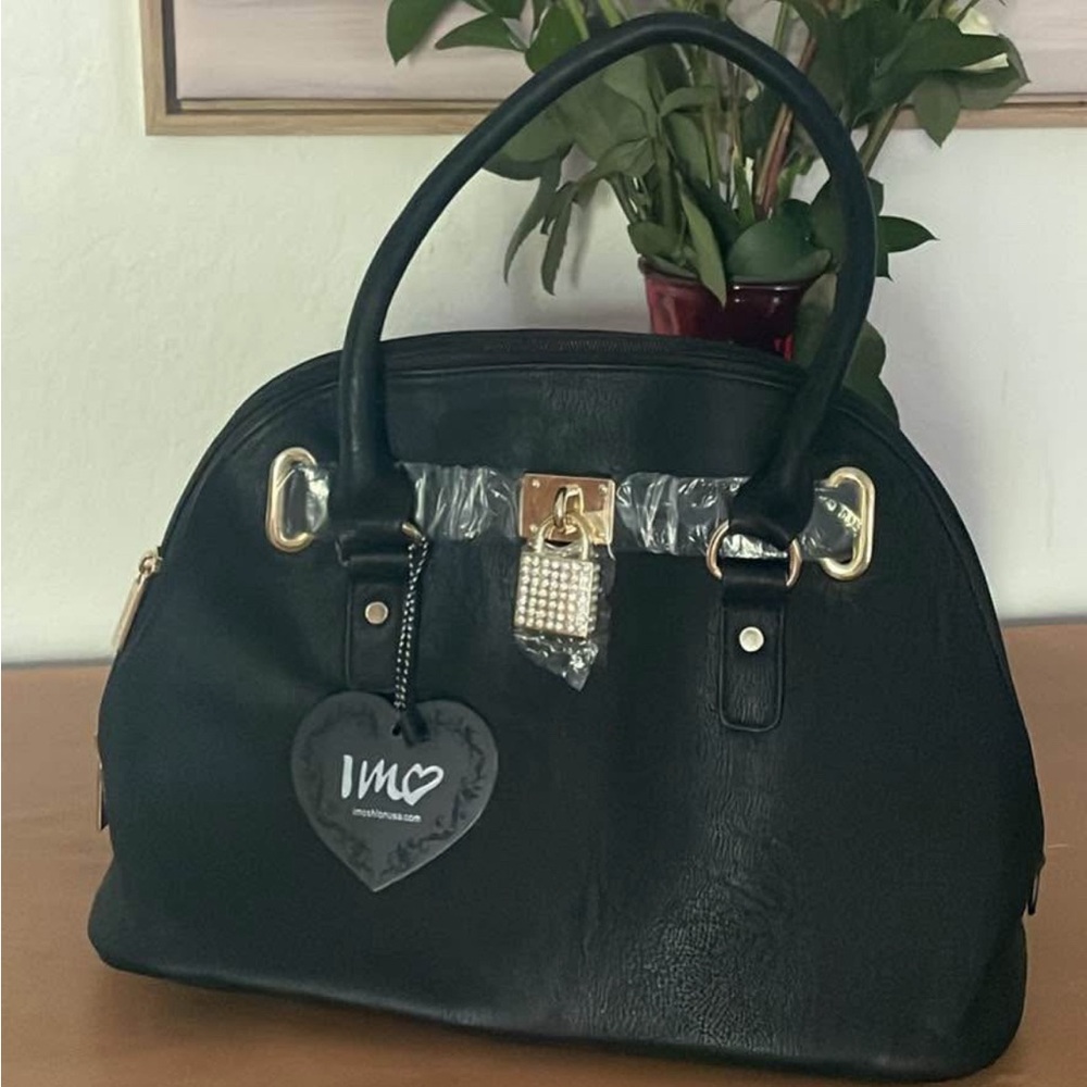 Elegant Black Handbag with Gold Accents